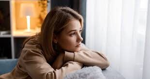 abortion option Girl looks solemnly out the window.